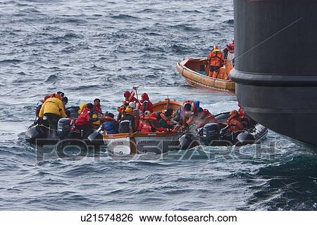 Rescue operation for sinking ship MV Explorer in Antarctica. View Large Photo Image Stock Photograph - Rescue operation for sinking ship MV Explorer in Antarctica.. Fotosearch