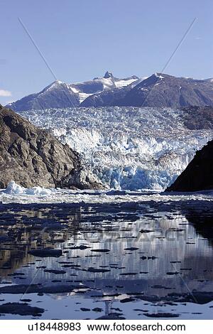 Sawyer Glacier with icebergs and ice bits calved off. Tracy Arm, Southeast Alaska, USA. Pacific Ocean. View Large Photo Image Stock Image - Sawyer Glacier with icebergs and ice bits calved off. Tracy Arm, Southeast Alaska, USA. Pacific Ocean.. Fotosearch