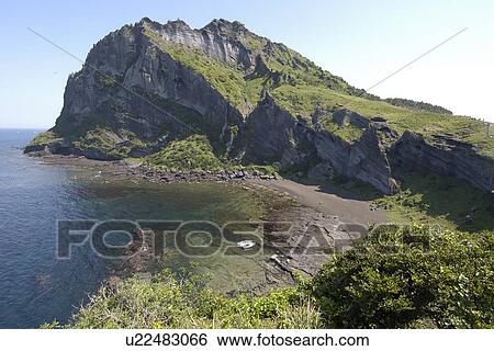Secluded beach on the slopes of Ilchulbong volcanic cone, Jeju-Do, South Korea View Large Photo Image Stock Photograph - Secluded beach on the slopes of Ilchulbong volcanic cone, Jeju-Do, South Korea. Fotosearch