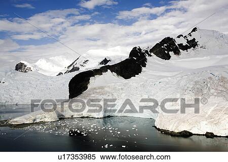 Snow and ice covered mountains in Paradise Bay on the Antarctic Peninsula. View Large Photo Image Stock Photography - Snow and ice covered mountains in Paradise Bay on the Antarctic Peninsula.. Fotosearch