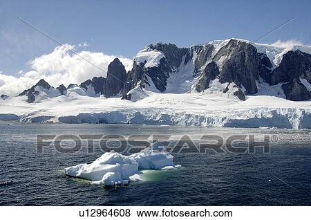 Spigot Peak, Arctowski Peninsula, Antarctica Iceberg in foreground View Large Photo Image Stock Photo - Spigot Peak, Arctowski Peninsula, Antarctica Iceberg in foreground. Fotosearch