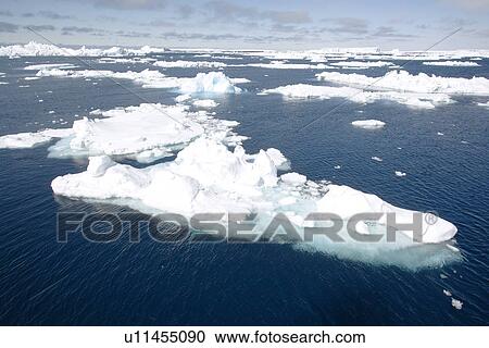 Strange and wonderful formations in the icebergs and bergy bits in and around the Antarctic Peninsula during the summer months. View Large Photo Image Stock Image - Strange and wonderful formations in the icebergs and bergy bits in and around the Antarctic Peninsula during the summer months.. Fotosearch