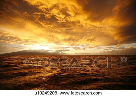 Sunset across the AuAu Channel between Maui and Lanai, looking west with Lanai in the background. Maui, Hawaii, USA. View Large Photo Image Stock Photo - Sunset across the AuAu Channel between Maui and Lanai, looking west with Lanai in the background. Maui, Hawaii, USA.. Fotosearch