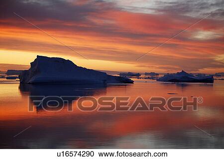 Sunset on fresh sea ice and tabular icebergs in the Weddell Sea, Antarctica. View Large Photo Image Stock Image - Sunset on fresh sea ice and tabular icebergs in the Weddell Sea, Antarctica.. Fotosearch
