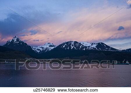 Sunset over the town of Ushuaia, Argentina on the island of Tierra del Fuego. This city bills itself as the southernmost city in the world. View Large Photo Image Stock Photo - Sunset over the town of Ushuaia, Argentina on the island of Tierra del Fuego. This city bills itself as the southernmost city in the world.. Fotosearch