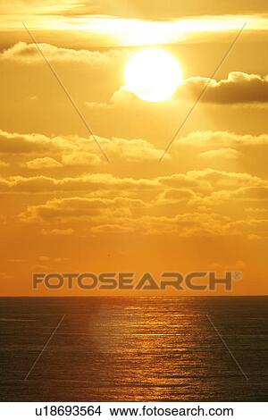 Picture - Sunset taken from the ferry, which is used by whale-watchers to cross Bay of Biscay, SW Europe.. Fotosearch