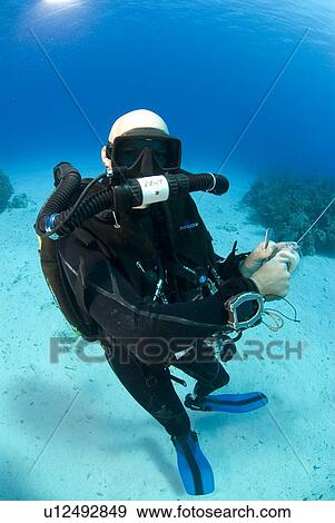 Technical Divers using Trimix, Rebreathers and technical diving equipment, Divetech, Grand Cayman, Cayman Islands, Caribbean View Large Photo Image Stock Photo - Technical Divers using Trimix, Rebreathers and technical diving equipment, Divetech, Grand Cayman, Cayman Islands, Caribbean. Fotosearch