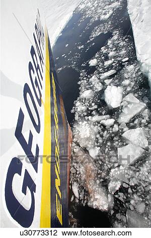The National Geographic Endeavour breaking through new fast ice around the Antarctic Peninsula. Note the orange hull paint left on the ice where the bow has pushed through. View Large Photo Image Stock Image - The National Geographic Endeavour breaking through new fast ice around the Antarctic Peninsula. Note the orange hull paint left on the ice where the bow has pushed through.. Fotosearch