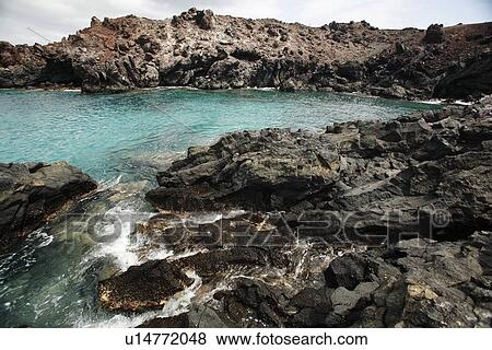 Volcanic rock shoreline on Ascension Island in the south Atlantic Ocean. View Large Photo Image Stock Photo - Volcanic rock shoreline on Ascension Island in the south Atlantic Ocean.. Fotosearch