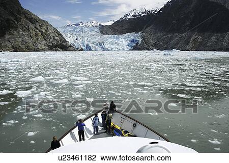 Working a boat through the ice of the Sawyer Glacier, a tidewater glacier at the end of Tracy Arm in Southeast Alaska, USA. View Large Photo Image Stock Image - Working a boat through the ice of the Sawyer Glacier, a tidewater glacier at the end of Tracy Arm in Southeast Alaska, USA.. Fotosearch