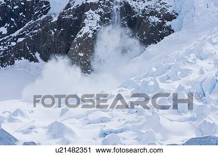 Stock Image - A glacier calving event in Neko Harbor in Anvers Bay on the west side of the Antarctic Peninsula.. Fotosearch
