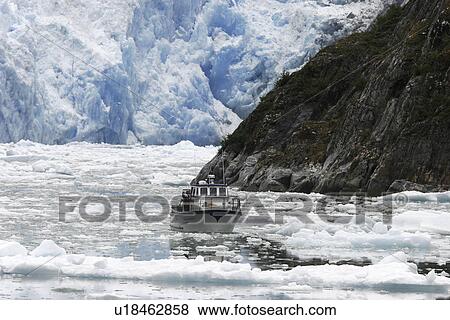 A tour ship navigates the ice of the Le Conte and Patterson Glaciers, the Stikine Ice Field, and the mountains surrounding the town of Petersburg, Southeast Alaska, USA. View Large Photo Image Stock Photo - A tour ship navigates the ice of the Le Conte and Patterson Glaciers, the Stikine Ice Field, and the mountains surrounding the town of Petersburg, Southeast Alaska, USA.. Fotosearch