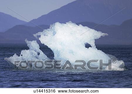 Stock Photograph - A very unusual iceberg calved from the Sawyer Glacier in Tracy Arm in southeast Alaska, USA. d. Fotosearch