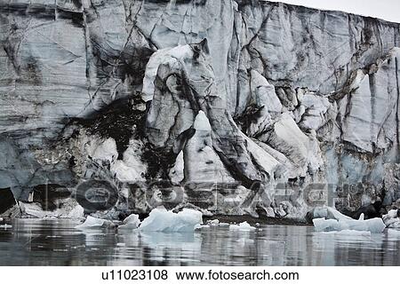 Stock Photo - A view of Storpollen Glacier, on the southwestern side of Spitsbergen Island in the Svalbard Archipelago, Barents Sea, Norway.. Fotosearch