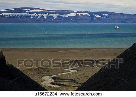 A view of the National Geographic Endeavour from the cliffs at Diskobukta on the western side of EdgeÏya in the Svalbard Archipelago in the Barents Sea. View Large Photo Image Picture - A view of the National Geographic Endeavour from the cliffs at Diskobukta on the western side of EdgeÏya in the Svalbard Archipelago in the Barents Sea.. Fotosearch