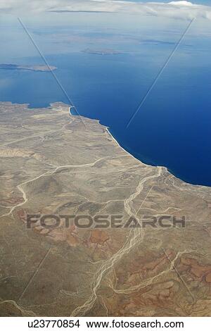 An aerial view of the Midriff region off the Baja Peninsula on the Gulf of California (Sea of Cortez) side. Baja California, Mexico. Foreground includes San Francisquito Harbor, then the midriff islands of San Lorenzo, Isla San Esteban, and finally Isla T View Large Photo Image Picture - An aerial view of the Midriff region off the Baja Peninsula on the Gulf of California (Sea of Cortez) side. Baja California, Mexico. Foreground includes San Francisquito Harbor, then the midriff islands of San Lorenzo, Isla San Esteban, and finally Isla T. Fotosearch