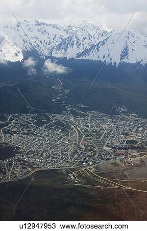 Stock Image - An aerial views of the town of Ushuaia, Argentina on the island of Tierra del Fuego. This city bills itself as the southernmost city in the world.. Fotosearch