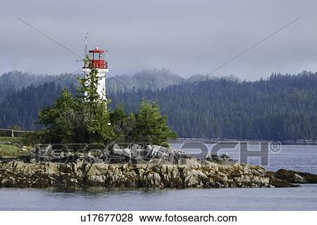 Stock Photo - An unmanned lighthouse and weather station along the inside passage in British Columbia, Canada.. Fotosearch