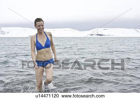Crew member Lisa Laegerstrom of the Lindblad Expedition ship National Geographic Endeavour taking the "polar plunge" in Port Foster on Deception Island in the South Shetland Islands, Antarctica. View Large Photo Image Stock Image - Crew member Lisa Laegerstrom of the Lindblad Expedition ship National Geographic Endeavour taking the "polar plunge" in Port Foster on Deception Island in the South Shetland Islands, Antarctica.. Fotosearch