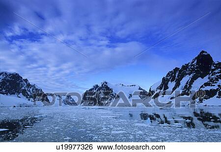 Stock Photograph - Early morning scenery of the Antarctic Peninsula Region. Lemaire Channel, Antarctic Peninsula, Antarctica.. Fotosearch