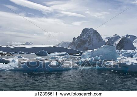 Huge icebergs near Petermann Island on the west side of the Antarctic Peninsula. View Large Photo Image Stock Image - Huge icebergs near Petermann Island on the west side of the Antarctic Peninsula.. Fotosearch