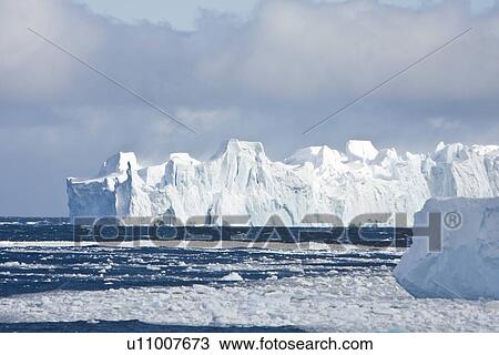 Iceberg detail in and around Crystal Sound near the Antarctic Circle on the Antarctic Peninsula during the summer months. More icebergs are being created as global warming is causing the breakup of major ice shelves and glaciers. View Large Photo Image Stock Image - Iceberg detail in and around Crystal Sound near the Antarctic Circle on the Antarctic Peninsula during the summer months. More icebergs are being created as global warming is causing the breakup of major ice shelves and glaciers.. Fotosearch