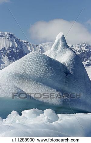 Iceberg detail in and around the Antarctic Peninsula during the summer months. More icebergs are being created as global warming is causing the break up of major ice sheets. View Large Photo Image Stock Image - Iceberg detail in and around the Antarctic Peninsula during the summer months. More icebergs are being created as global warming is causing the break up of major ice sheets.. Fotosearch