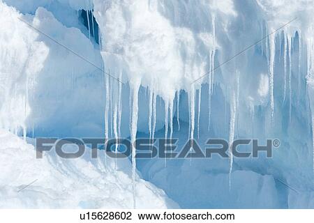 Stock Image - Iceberg detail in and around the Antarctic Peninsula during the summer months. More icebergs are being created as global warming is causing the breakup of major ice shelves and glaciers.. Fotosearch
