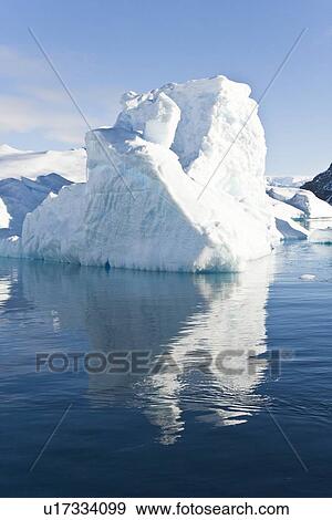 Iceberg detail in and around the Antarctic Peninsula during the summer months. More icebergs are being created as global warming is causing the breakup of major ice shelves and glaciers. View Large Photo Image Stock Photo - Iceberg detail in and around the Antarctic Peninsula during the summer months. More icebergs are being created as global warming is causing the breakup of major ice shelves and glaciers.. Fotosearch
