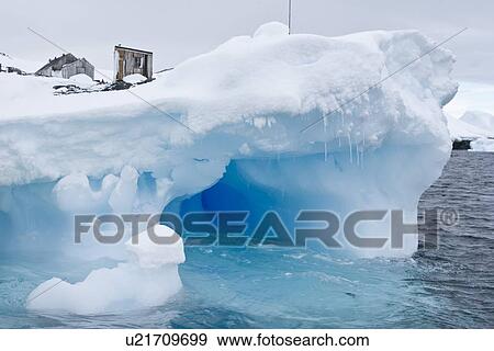 Iceberg detail in and around the abandoned British research base "W" in Crystal Sound near the Antarctic Peninsula during the summer months. More icebergs are being created as global warming is causing the breakup of major ice shelves and glaciers. View Large Photo Image Stock Photo - Iceberg detail in and around the abandoned British research base "W" in Crystal Sound near the Antarctic Peninsula during the summer months. More icebergs are being created as global warming is causing the breakup of major ice shelves and glaciers.. Fotosearch