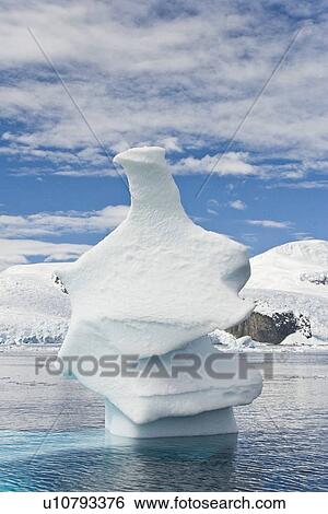 Stock Photograph - Iceberg detail in and around the Antarctic Peninsula during the summer months. More icebergs are being created as global warming is causing the breakup of major ice shelves and glaciers.. Fotosearch
