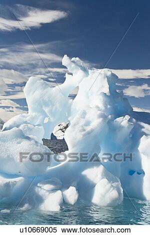 Iceberg detail in and around the Antarctic Peninsula during the summer months. More icebergs are being created as global warming is causing the breakup of major ice shelves and glaciers. View Large Photo Image Stock Photography - Iceberg detail in and around the Antarctic Peninsula during the summer months. More icebergs are being created as global warming is causing the breakup of major ice shelves and glaciers.. Fotosearch