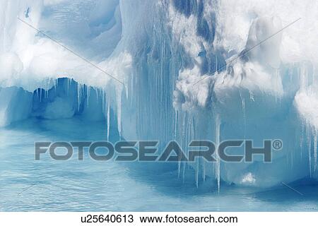Icebergs and bergy bits melting (note the icicles) in and around the Antarctic Peninsula during the summer months. View Large Photo Image Stock Image - Icebergs and bergy bits melting (note the icicles) in and around the Antarctic Peninsula during the summer months.. Fotosearch