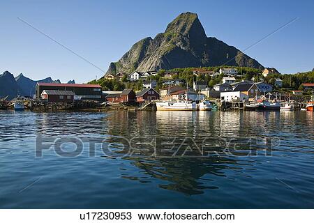 Late evening light on the picturesque Norwegian fishing town of Reine in the Lofoton Island Group, Norway. View Large Photo Image Stock Image - Late evening light on the picturesque Norwegian fishing town of Reine in the Lofoton Island Group, Norway.. Fotosearch