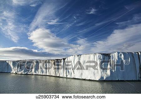 Picture - Late evening views of the Negrebreen Glacier melting in the sunlight on Spitsbergen Island in the Svalbard Archipelago, Barents Sea, Norway.. Fotosearch