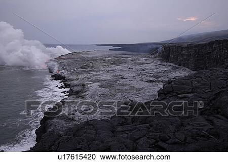 Stock Image - Lava flowing into the Pacific Ocean, Volcanoes National Park, Big Island, Hawaii. Fotosearch