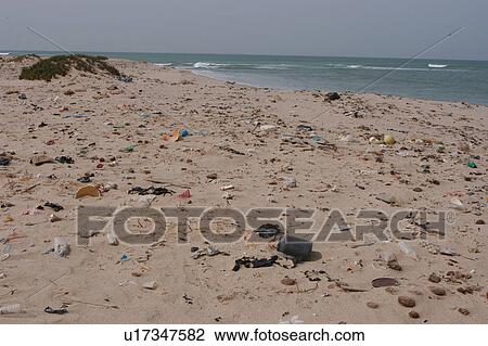 Stock Image - Litter washed up on beach, Southern Morocco. Fotosearch