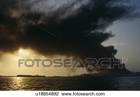 Oil refinery on fire. Island in Arabian Gulf View Large Photo Image Stock Image - Oil refinery on fire. Island in Arabian Gulf. Fotosearch