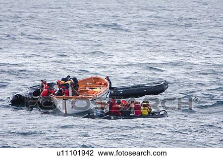 Stock Image - Rescue operation for sinking ship MV Explorer in Antarctica.. Fotosearch