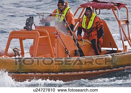 Stock Image - Rescue operation for sinking ship MV Explorer in Antarctica.. Fotosearch