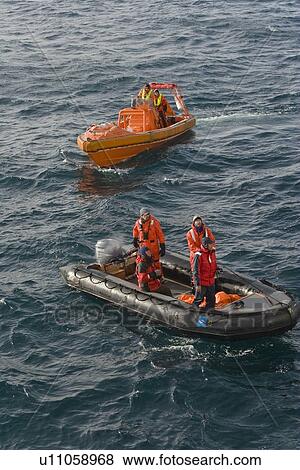 Stock Photo - Rescue operation for sinking ship MV Explorer in Antarctica.. Fotosearch