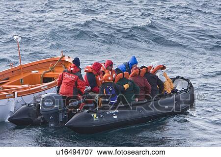 Stock Photo - Rescue operation for sinking ship MV Explorer in Antarctica.. Fotosearch