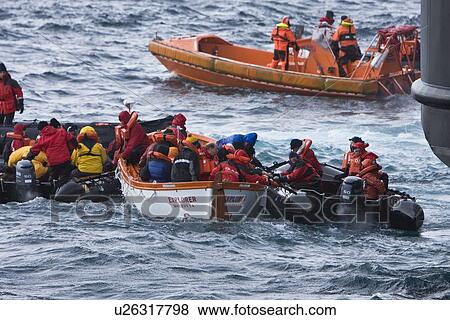 Stock Photo - Rescue operation for sinking ship MV Explorer in Antarctica.. Fotosearch