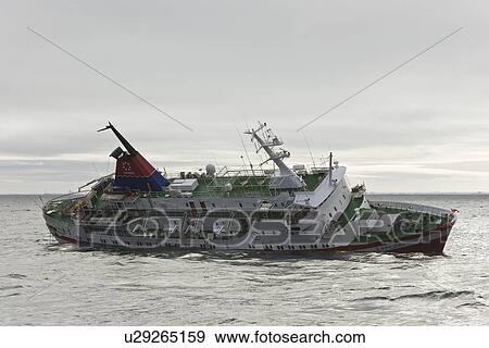 Stock Photo - Rescue operation for sinking ship MV Explorer in Antarctica.. Fotosearch