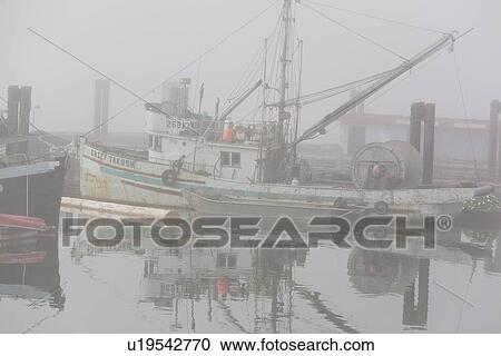 Stock Image - Scenes from the harbour on a foggy day in Alert Bay on Cormorant Island, British Columbia, Canada. No model or property releases.. Fotosearch