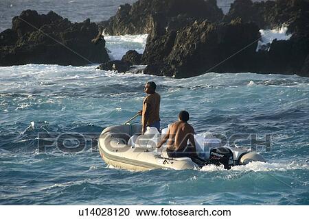 Stock Image - Skiff transporting water, St. Peter and St. Paul's rocks, Brazil, Atlantic Ocean . Fotosearch