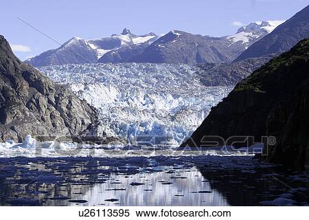 Stock Photography - South Sawyer Glacier with icebergs and bits calved off. Tracy Arm, Southeast Alaska, USA. Pacific Ocean.. Fotosearch
