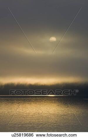 Sunrise on fog-shrouded Idaho Inlet, Southeast Alaska, USA. Pacific Ocean. View Large Photo Image Stock Photograph - Sunrise on fog-shrouded Idaho Inlet, Southeast Alaska, USA. Pacific Ocean.. Fotosearch