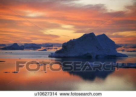 Sunset on fresh sea ice and tabular icebergs in the Weddell Sea, Antarctica. View Large Photo Image Picture - Sunset on fresh sea ice and tabular icebergs in the Weddell Sea, Antarctica.. Fotosearch