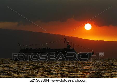 Sunset on tourist boat across the AuAu Channel between Maui and Lanai, looking west with Lanai in the background. Maui, Hawaii, USA. View Large Photo Image Picture - Sunset on tourist boat across the AuAu Channel between Maui and Lanai, looking west with Lanai in the background. Maui, Hawaii, USA.. Fotosearch